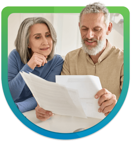 Elderly couple looking at mortgage form