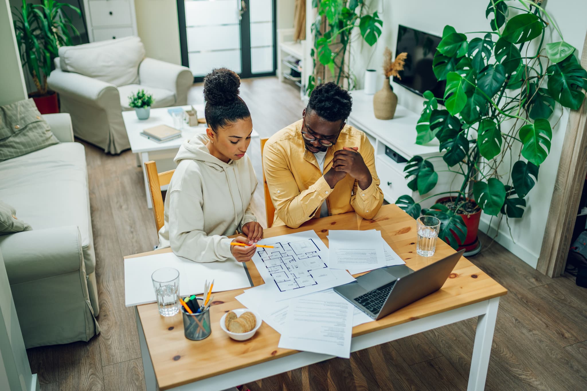 Couple looking at Laptop and documents