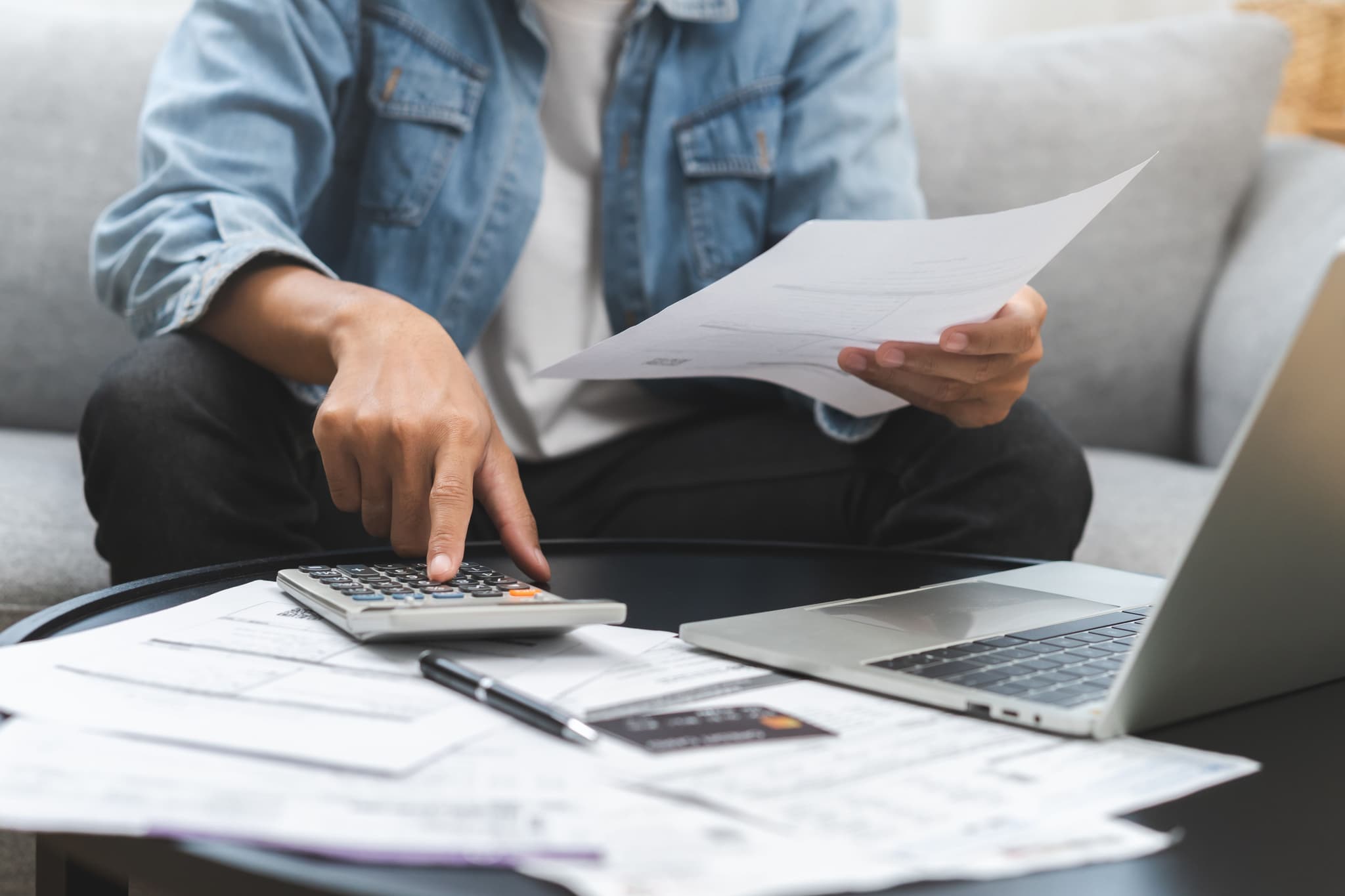 Image of man calculating mortgage costs