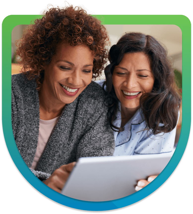 image of two ladies on a laptop