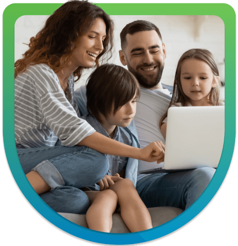 Family surrounding a laptop